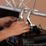 depositphotos_203987566-stock-video-a-technician-attaches-the-lighting